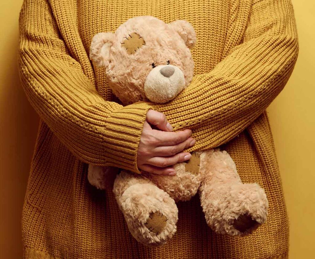 Woman holding teddy bear